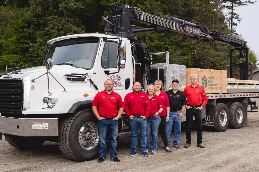Gold Beach Lumber team standing in front of lumber delivery truck